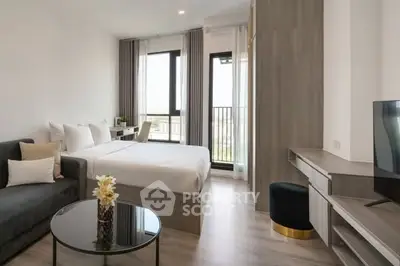 Modern bedroom with stylish decor and balcony view