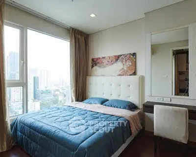 Luxurious bedroom with stunning city view and elegant decor