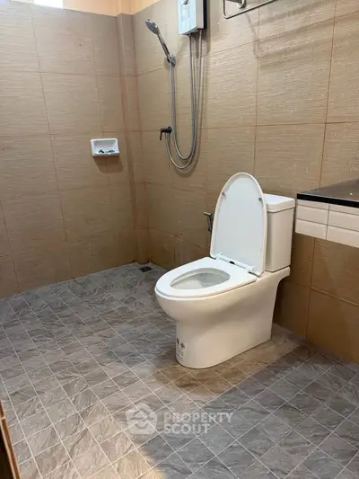 Modern bathroom with sleek tiles and contemporary fixtures, perfect for a stylish home.