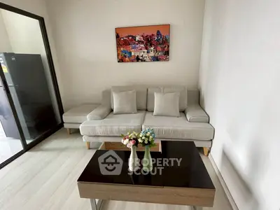 Modern living room with stylish sofa and vibrant wall art