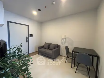 Modern living room with cozy sofa and dining area in minimalist apartment.