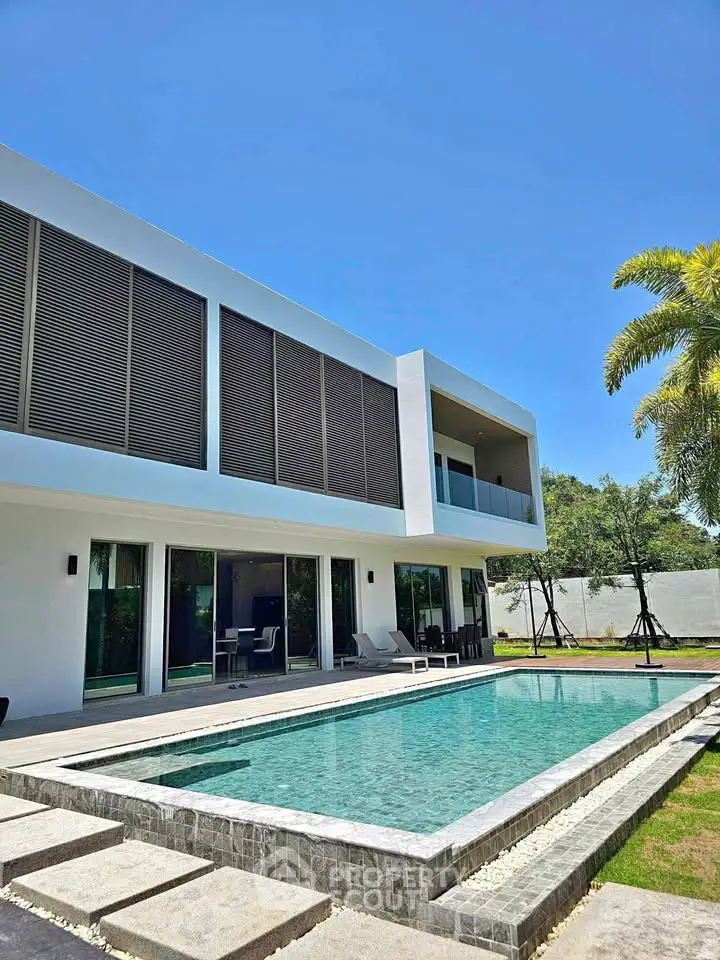 Luxurious modern villa with private pool and spacious outdoor area, perfect for relaxation and entertainment.