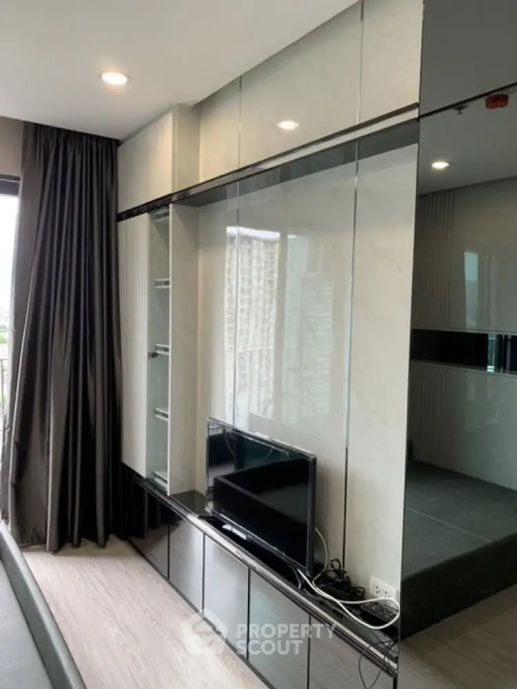 Modern living room with sleek built-in shelving and large window view