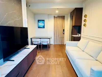 Modern living room with sleek furniture and large TV in stylish apartment