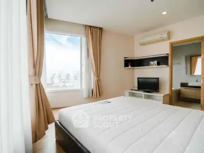Bright and airy bedroom with city view and modern amenities