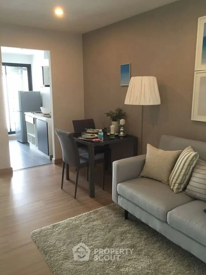 Cozy living room with modern decor and open kitchen layout