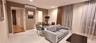 Modern living room with elegant dining area and stylish decor in a contemporary apartment.