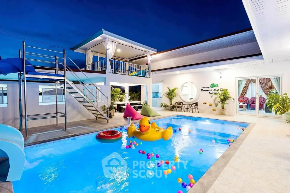 Luxurious villa with private pool and vibrant outdoor decor, perfect for family gatherings and relaxation.