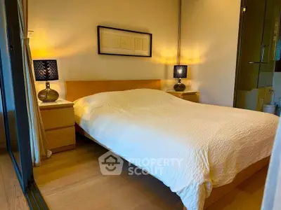 Cozy bedroom with modern decor and warm lighting