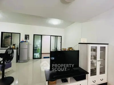 Spacious living room with modern decor and sleek appliances