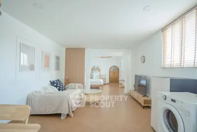 Spacious living room with modern decor and natural light