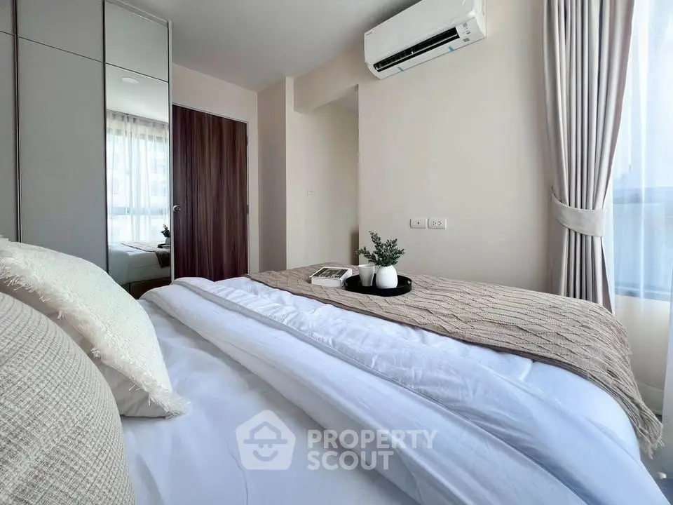 Modern bedroom with cozy bedding and natural light