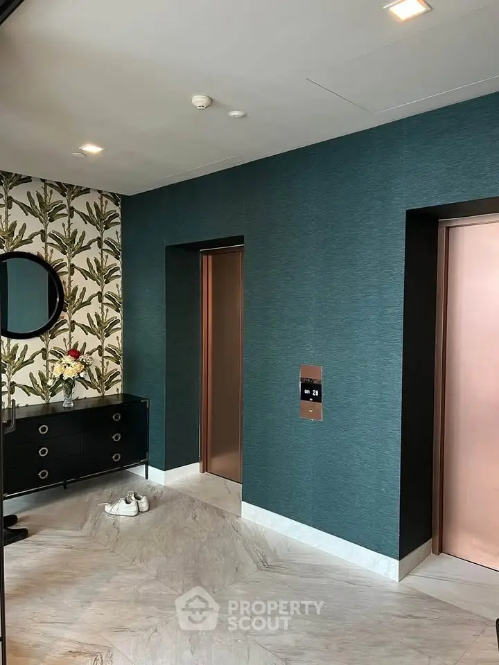 Stylish modern elevator lobby with chic wallpaper and elegant decor