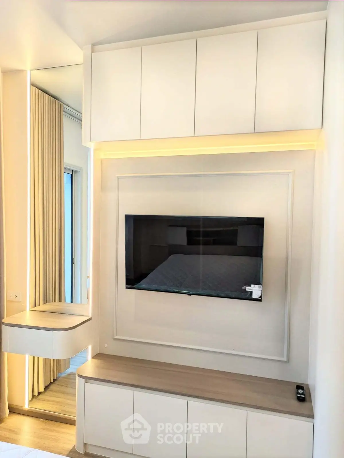 Modern living room with sleek TV unit and elegant cabinetry