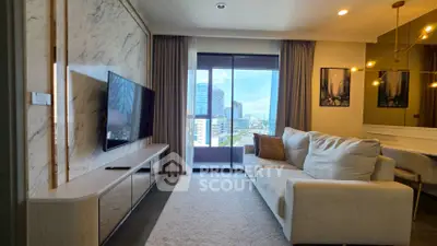 Modern living room with city view, elegant decor, and natural light.