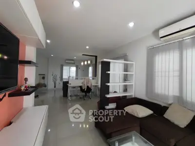 Modern living room with sleek design and cozy seating area