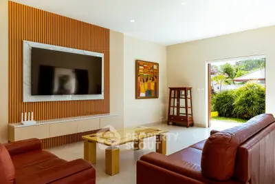 Luxurious living room with modern decor and garden view
