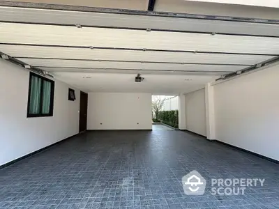 Spacious modern garage with sleek design and ample parking space