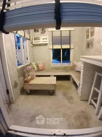 Cozy small living room with rustic decor and natural light