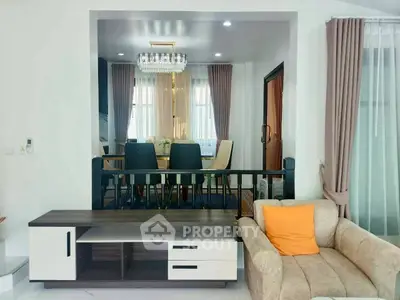 Elegant living room with modern decor and dining area view