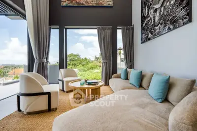 Luxurious living room with modern decor and stunning view through large windows.