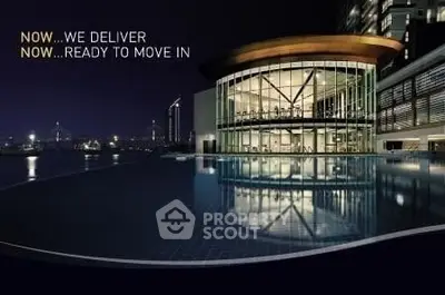 Luxurious modern building with stunning pool and city view, ready for immediate move-in.