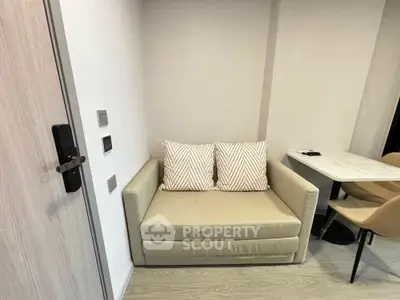 Cozy modern living room with stylish beige sofa and dining area