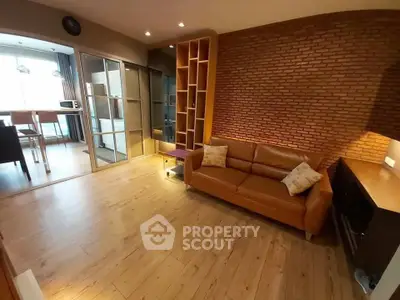 Stylish living room with brick accent wall and modern furnishings