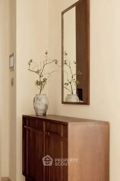 Elegant hallway with wooden console and decorative mirror