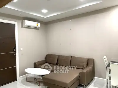 Modern living room with brown sofa and sleek design