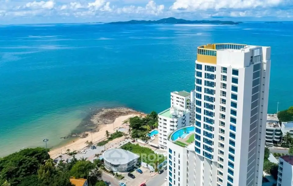 Stunning beachfront high-rise with panoramic ocean views and luxurious amenities.
