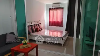 Cozy bedroom with modern decor and natural light, featuring a comfortable bed and stylish furnishings.