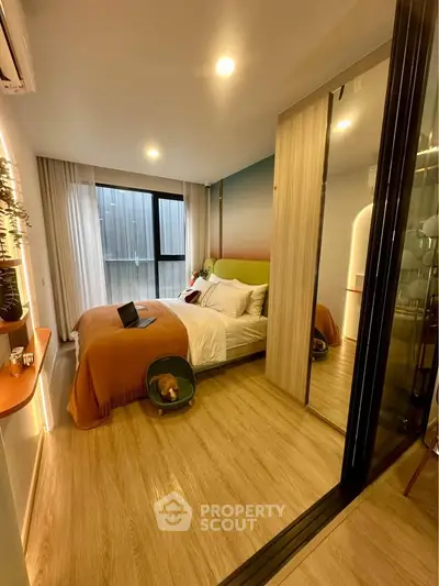 Cozy modern bedroom with mirrored wardrobe and stylish decor