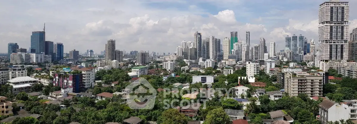 Stunning panoramic cityscape view showcasing a vibrant urban skyline with lush greenery and diverse architecture.