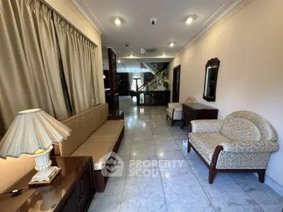 Elegant living room with classic furniture and marble flooring in a luxurious home