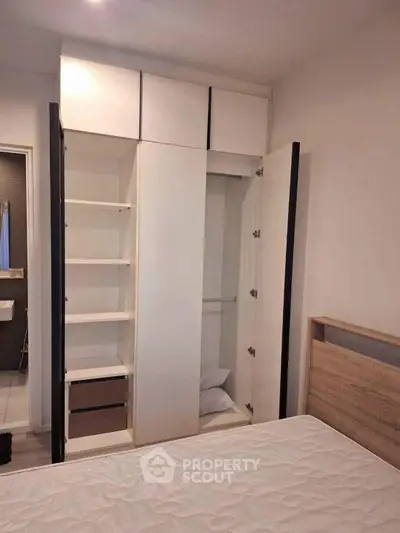 Spacious bedroom with built-in wardrobe and modern design, perfect for comfortable living.