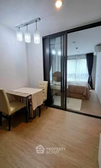 Modern studio apartment with dining area and cozy bedroom