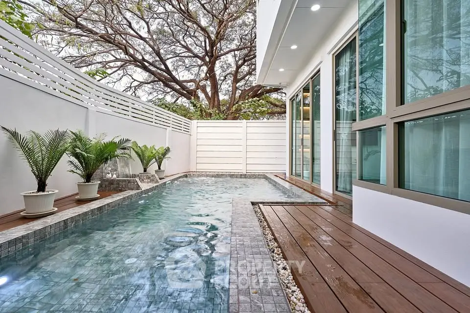 Luxurious modern home with private pool and elegant deck, perfect for relaxation and entertainment.