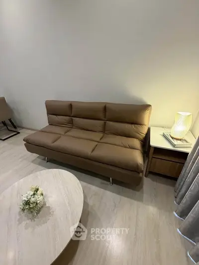 Modern living room with stylish brown sofa and elegant decor