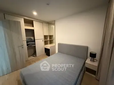 Modern bedroom with built-in wardrobe and cozy lighting