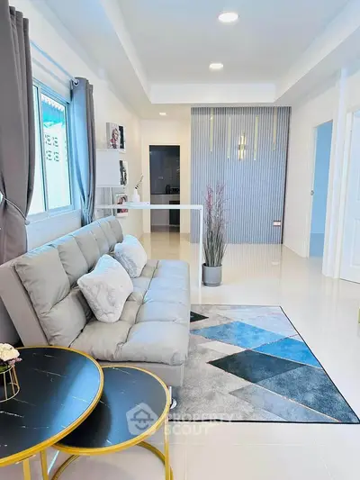 Modern living room with stylish decor and cozy seating area
