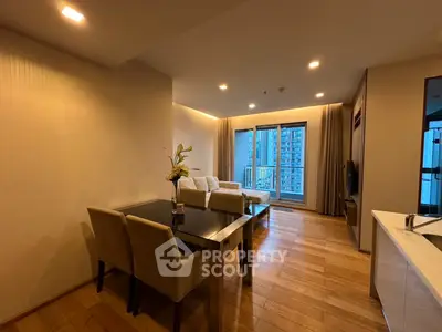 Modern living room with elegant decor and city view balcony