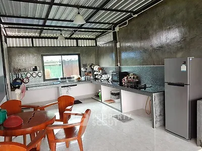 Spacious open-layout kitchen with modern appliances and dining area