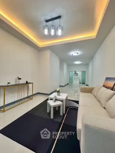 Modern living room with elegant lighting and cozy beige sofa