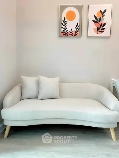 Stylish modern living room with elegant sofa and artistic wall decor