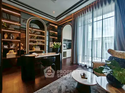 Luxurious living room with elegant decor and large windows offering natural light