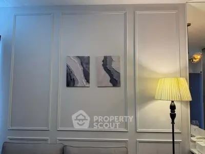 Elegant living room with modern wall art and stylish floor lamp