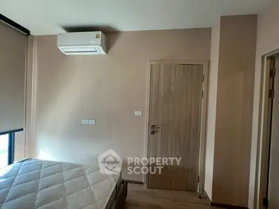 Cozy bedroom with air conditioning and natural light