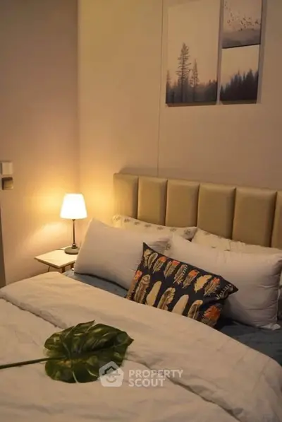 Cozy bedroom with elegant decor and soft lighting, perfect for relaxation.