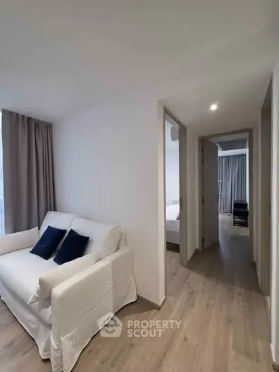 Modern apartment interior with cozy living area and hallway view
